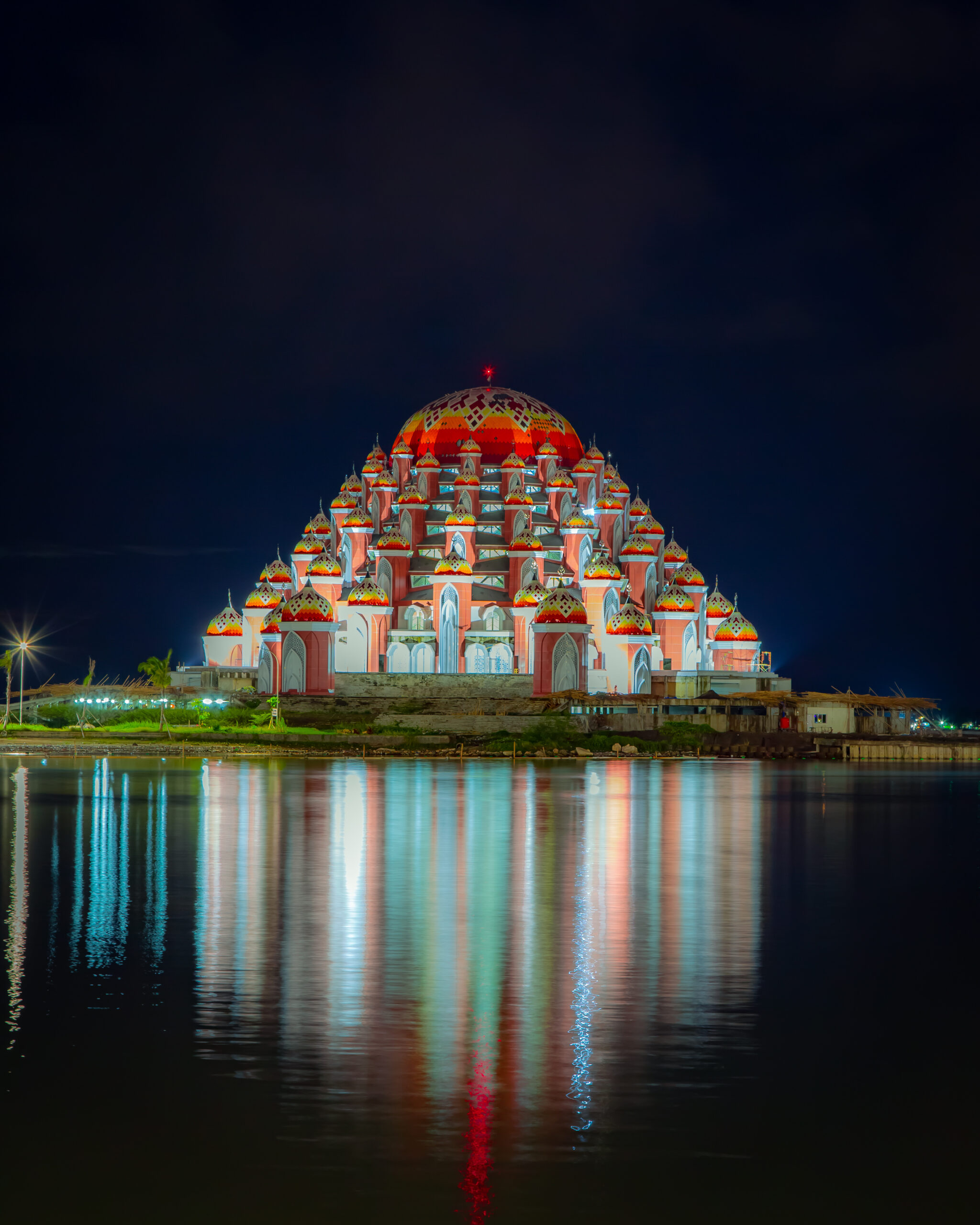 large-building-with-red-white-lights-top-it
